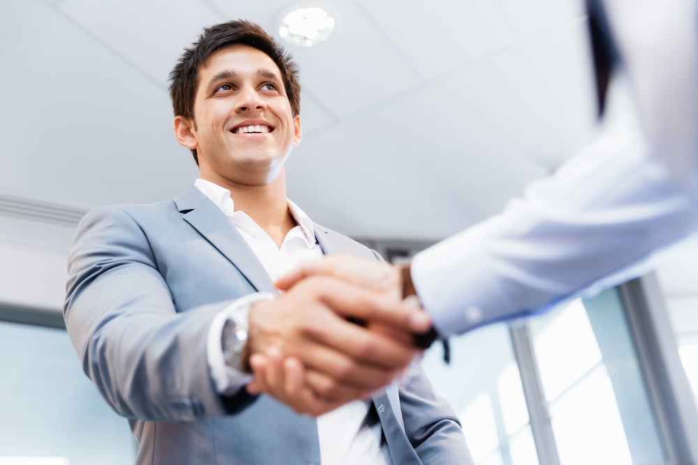 Handshake of businessmen greeting each other