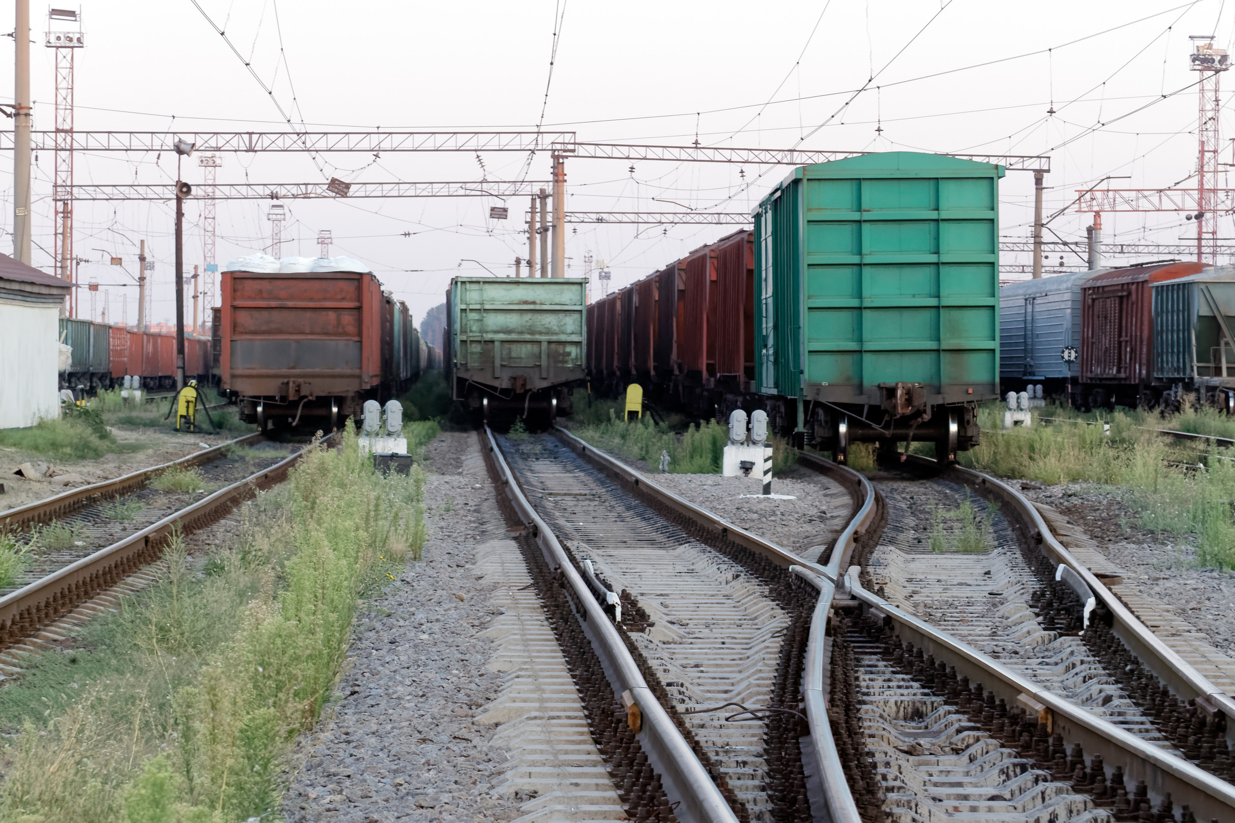 various railway cars idling in a rail yard