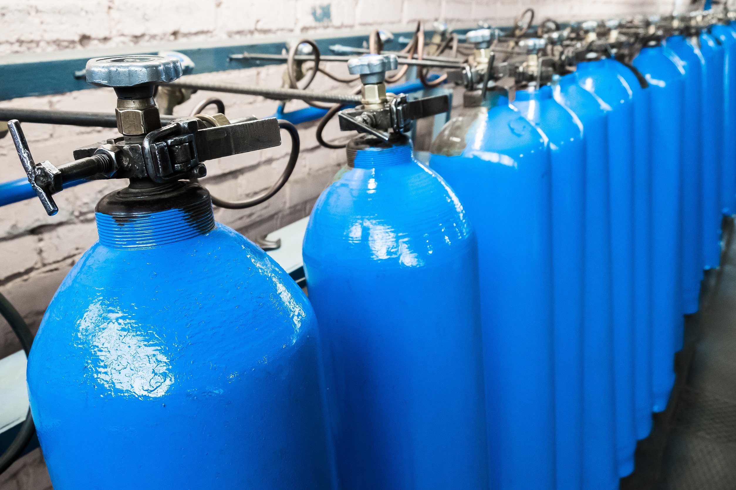 a row of compressed gas canisters