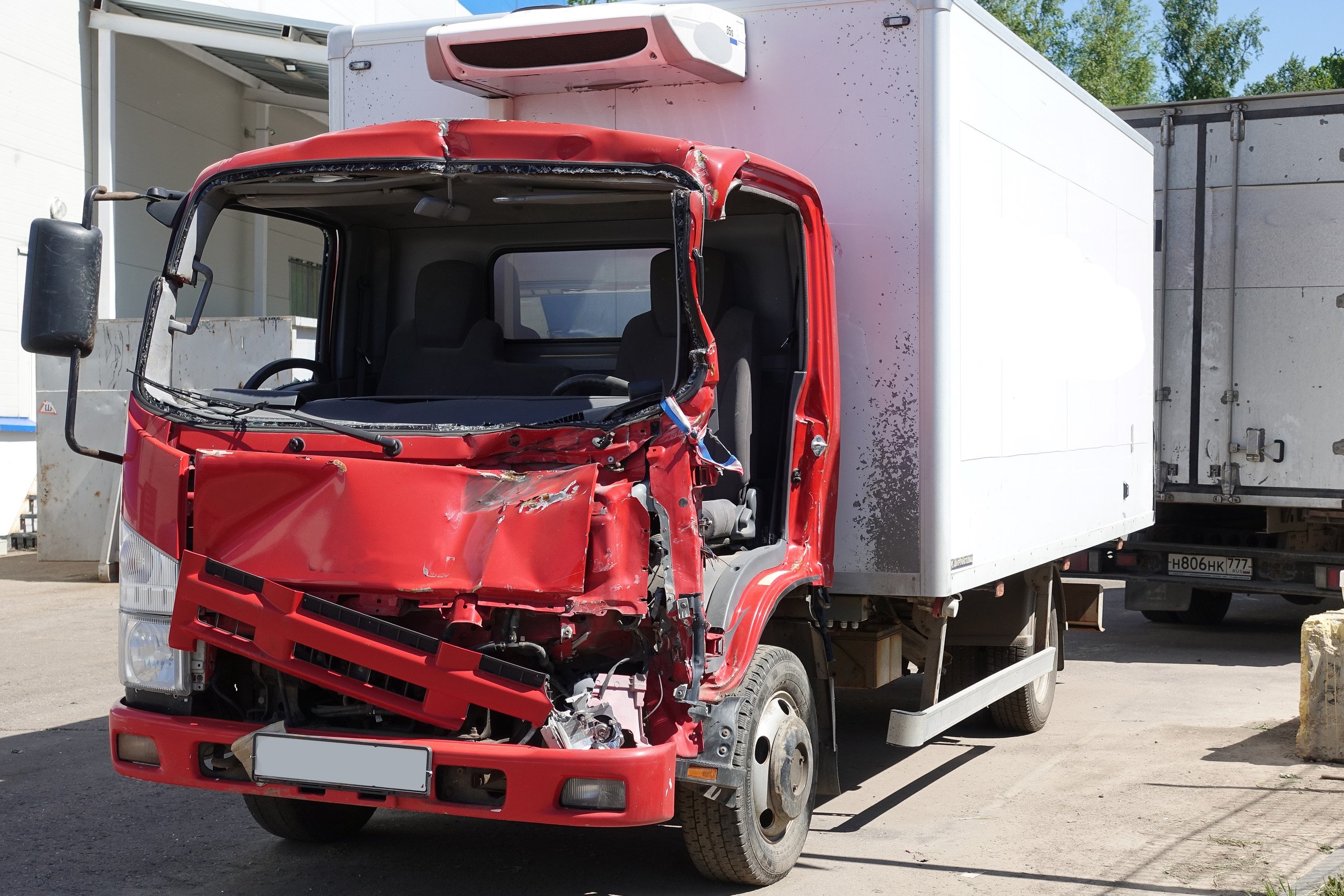 a damaged box truck after a collision