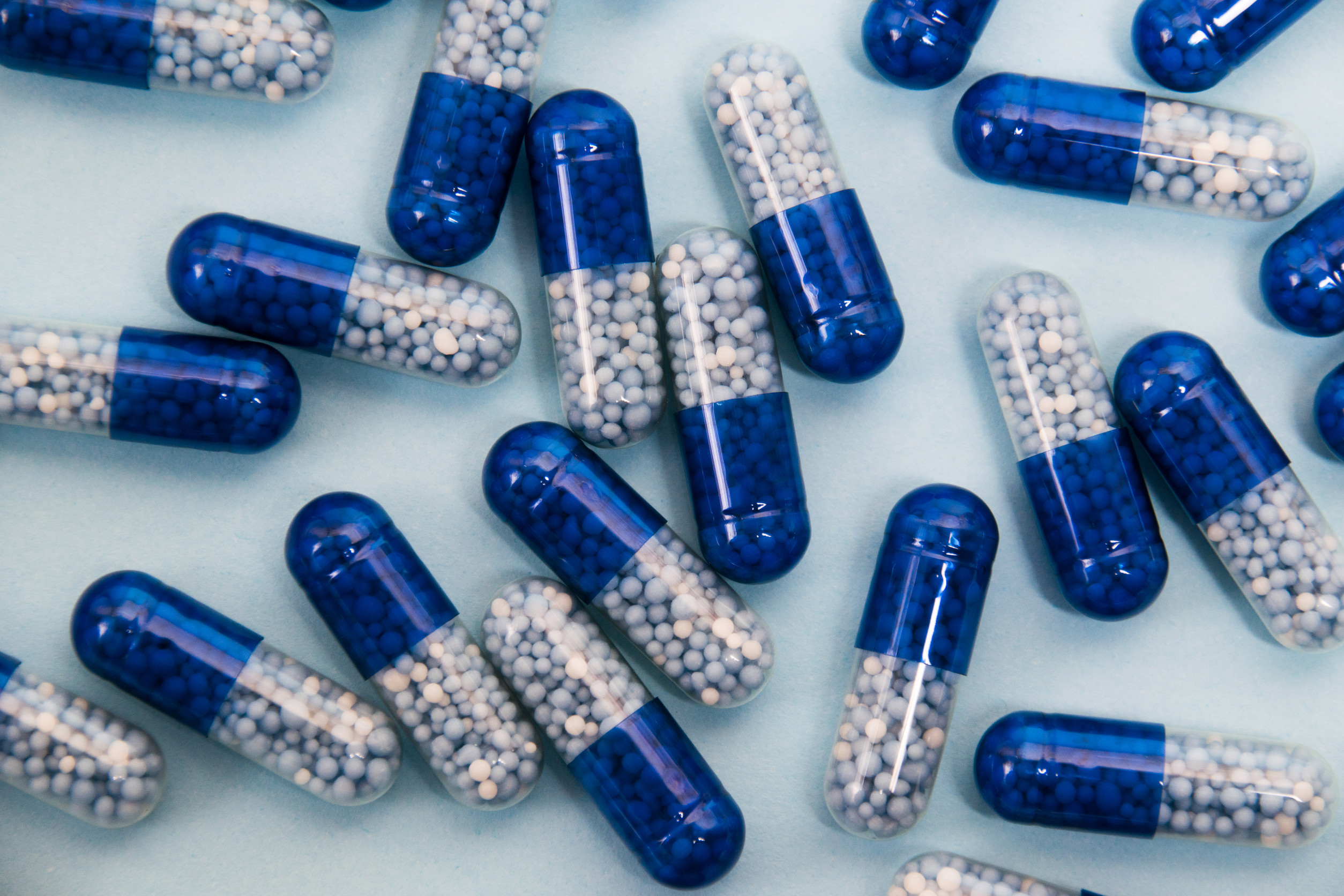 a scattering of blue and white pills