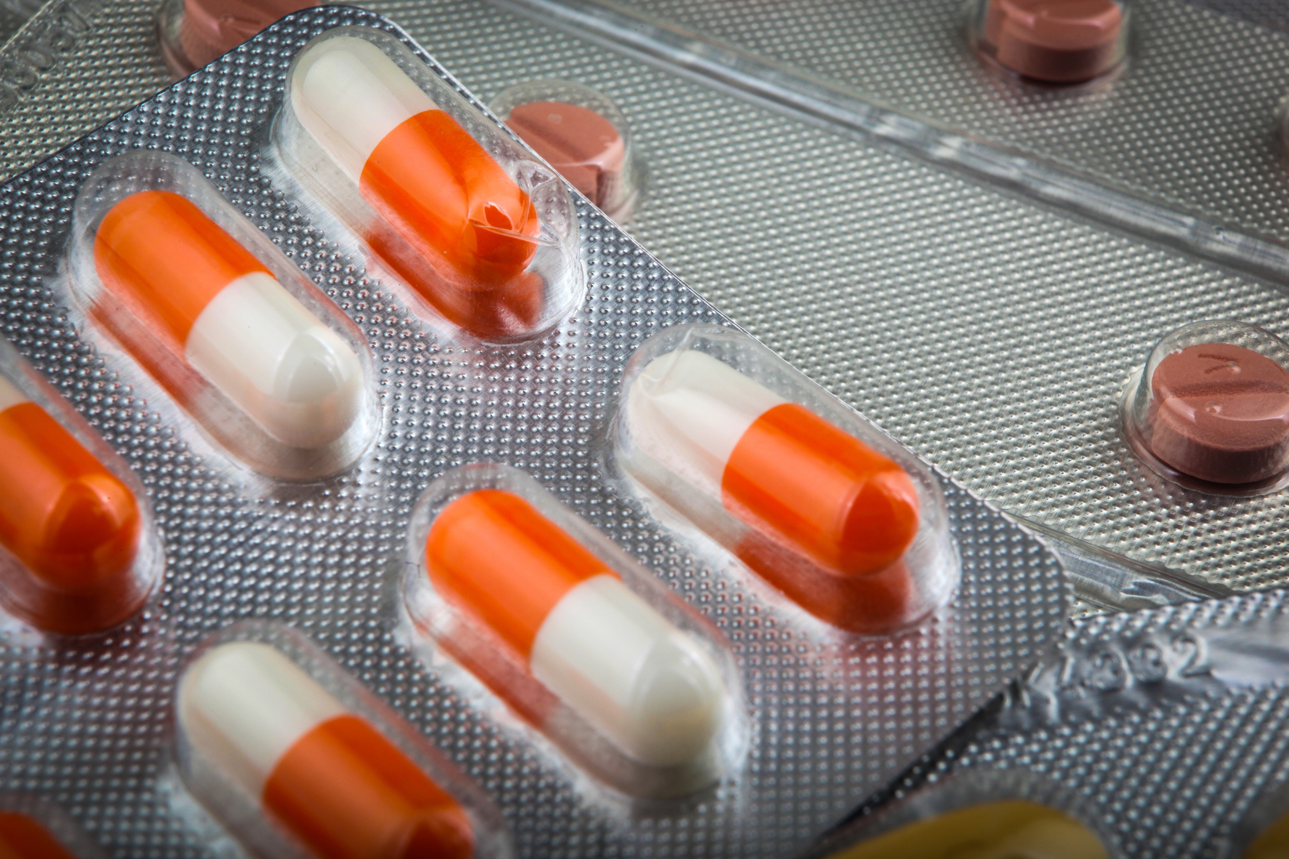 closeup of medicine capsules in sheet packaging