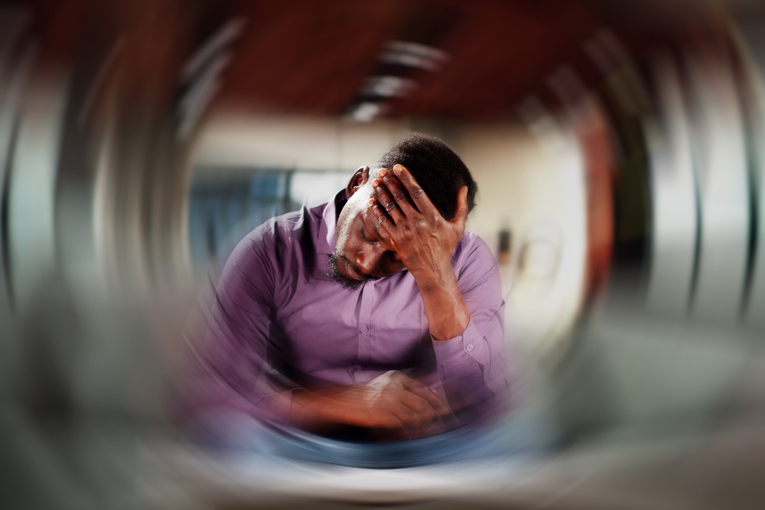 dramatic representation of a person experiencing dizziness and blurred vision