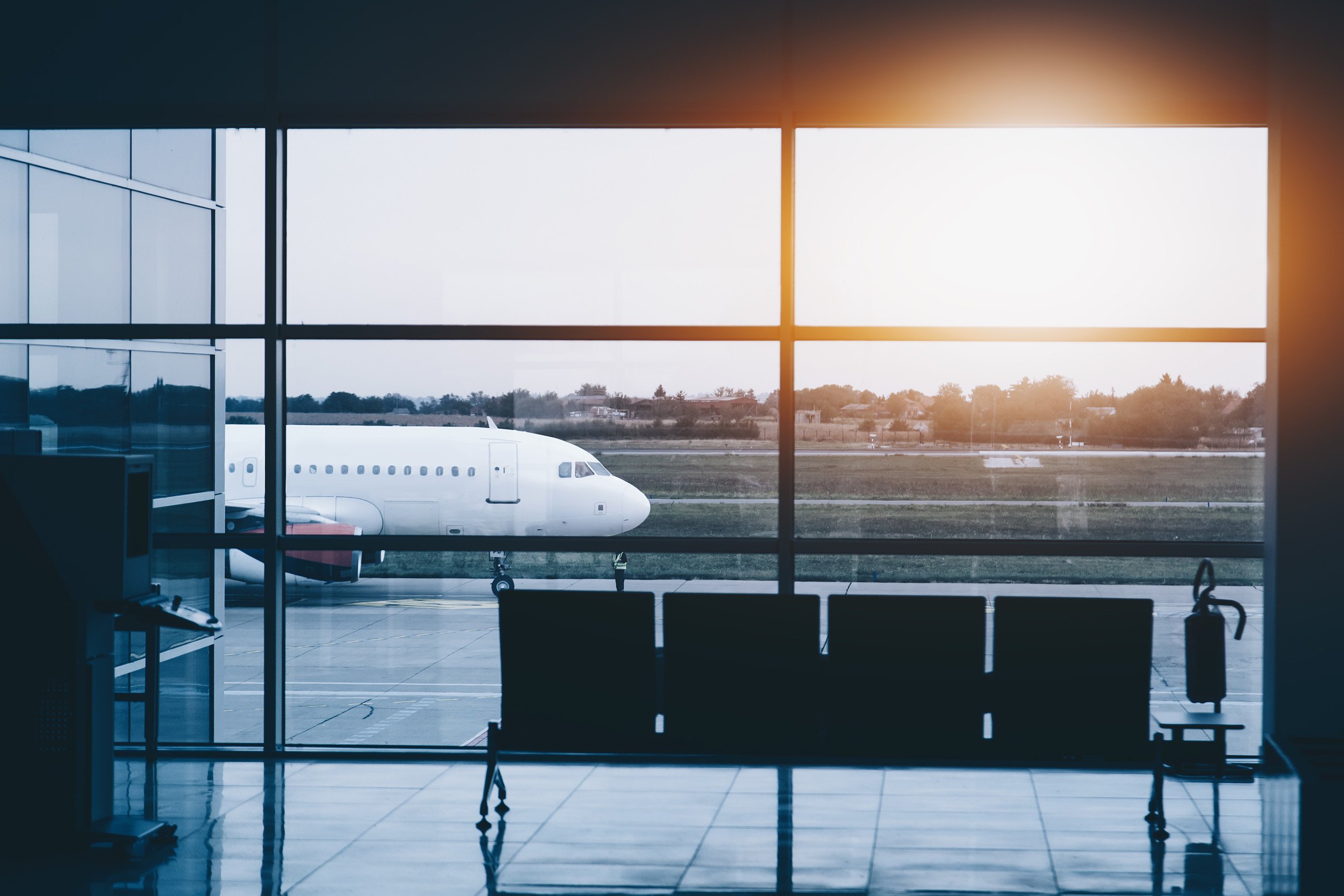 view of an airplane from an airport boarding area