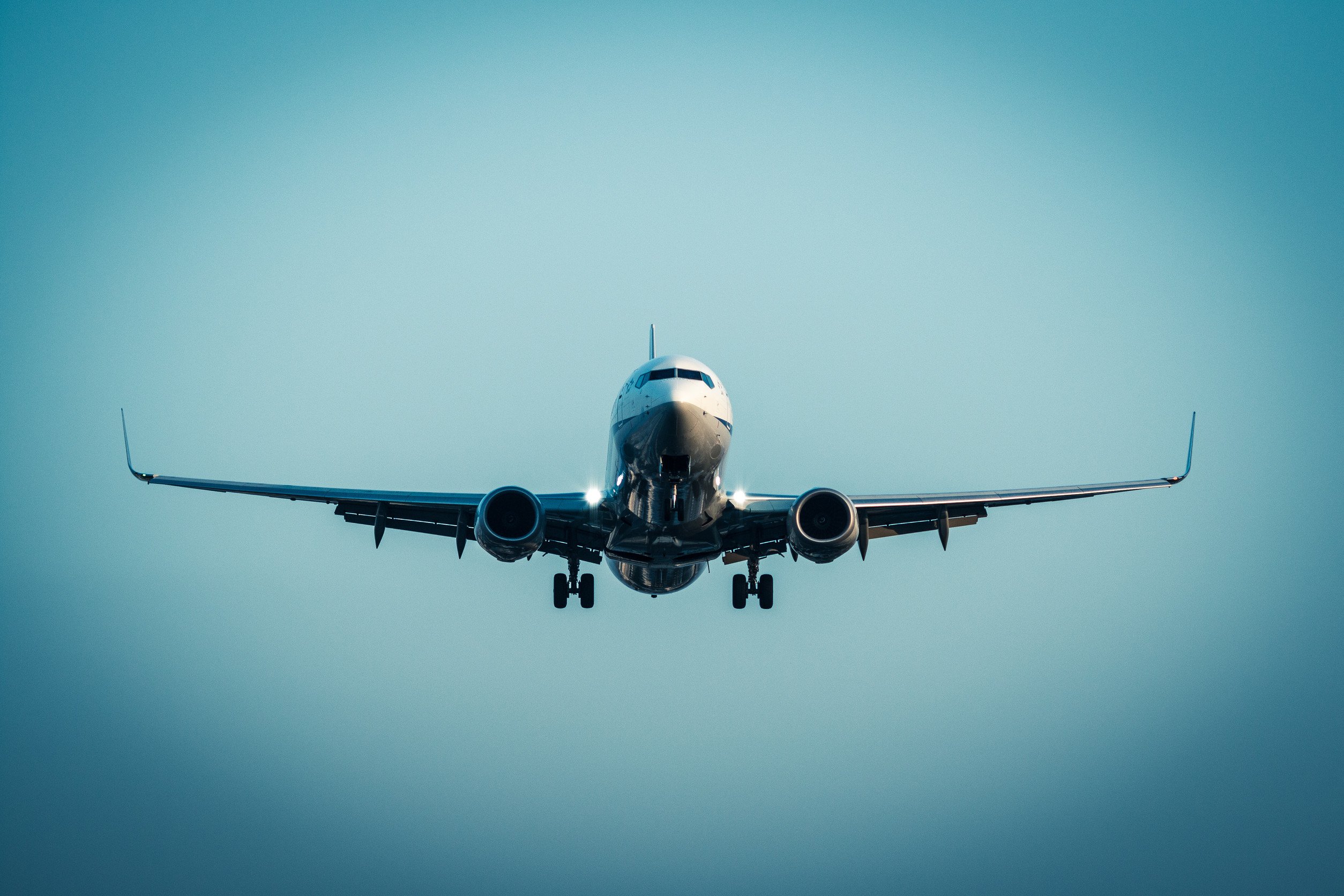 an airplane in the sky viewed from the front
