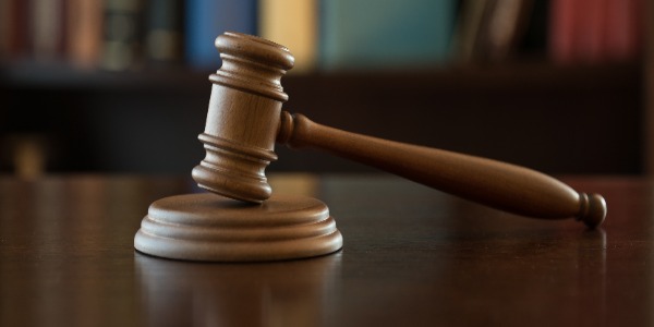 Wooden gavel on desk