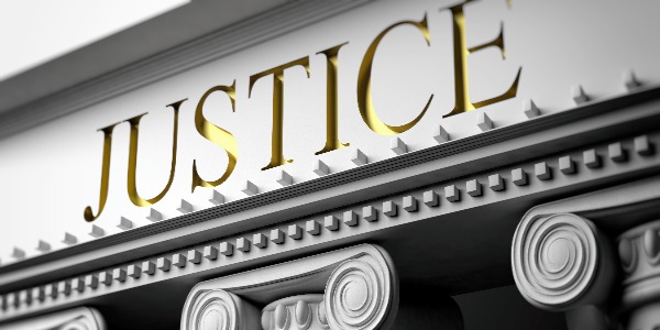 courthouse-justice-written-on-a-marble-pillars-building-facade-close-up-view