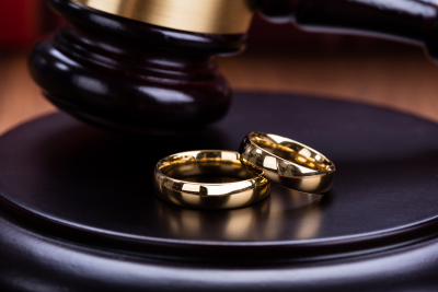Two rings resting on a gavel's stand