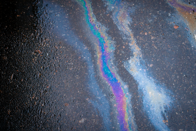 Oil spilled on asphalt