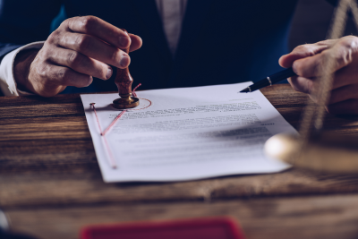 a document being stamped on a desk
