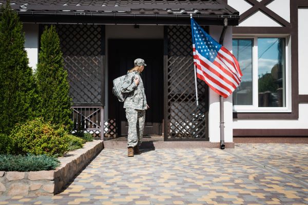 Femal Veteran Outside of her home Blue Water Navy Vietnam Veterans Act | VA Benefits Attorney