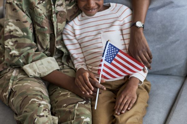 New and Material Evidence Veteran and Child sitting together