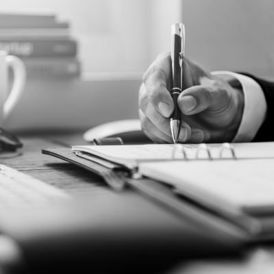 Man writing in notebook