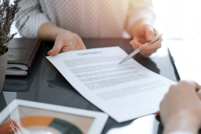 two people discuss the details of a contract