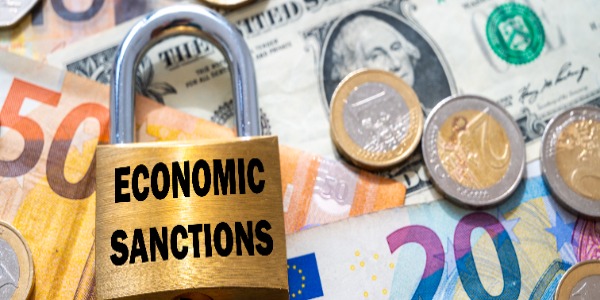 padlock-with-economic-sanctions-text-next-to-money-