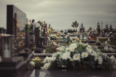 Close up of flowers on a graves at cemetery