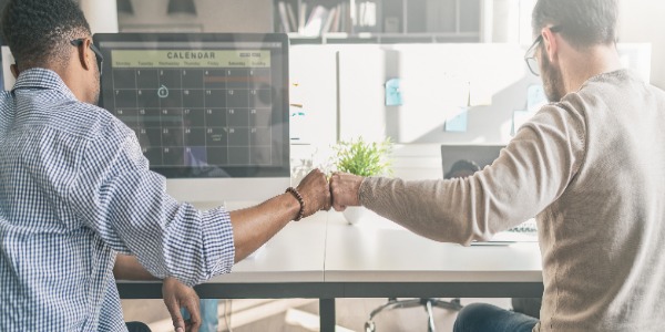 first-bump-between-colleagues-at-work-success-in-business