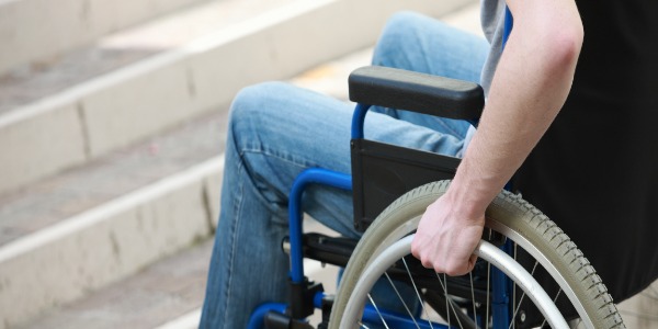 a-young-man-in-a-wheelchair-who-can-t-get-up-the-stairs