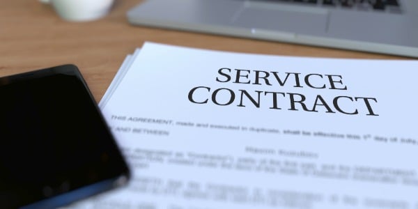 paper contract laid out on a desk