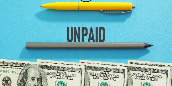 unpaid-time-is-shown-using-a-text-and-photo-of-dollars