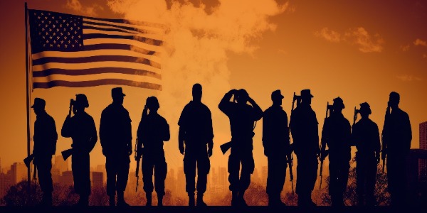 silhouettes-of-soldiers-standing-proudly-in-front-of-us-flag