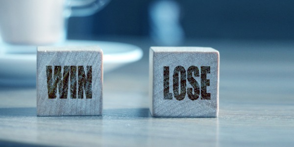 win-and-lose-on-wooden-cubes-and-cacao-cup-business-success-and-failure-concept